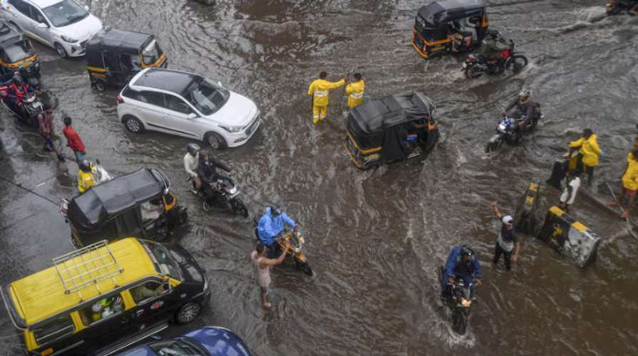 Heavy Rains Cause Flooding in Mumbai Red Alert Issued by IMD